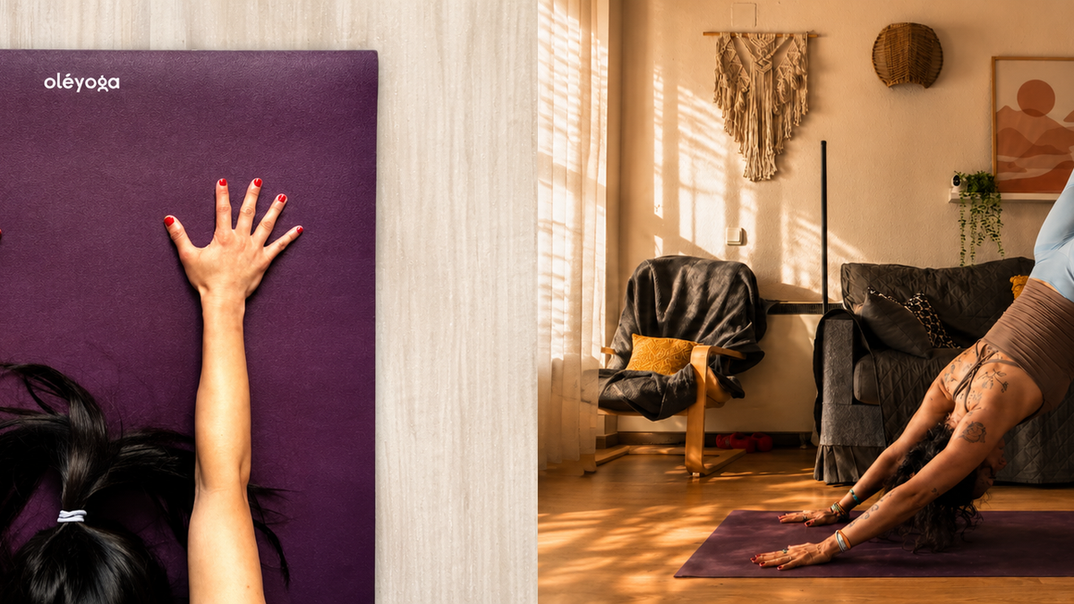 Hands on an oléyoga mat and yoga practice in a sunlit room
