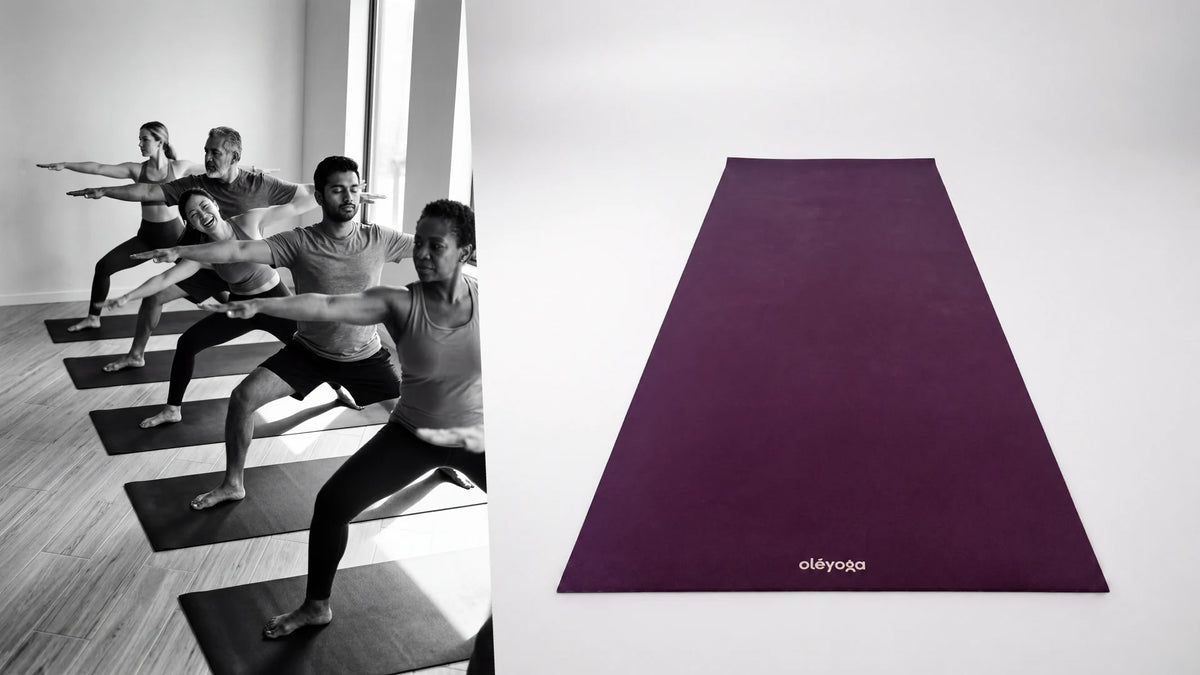 Black and white class holding warrior II in a row of mats, next to the purple natural rubber mat seen front on
