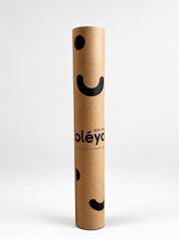 Sustainable packaging: recycled-paper wrap with no extra plastic. Inside, the Eco Daily in 100% natural rubber with GoalGrip™